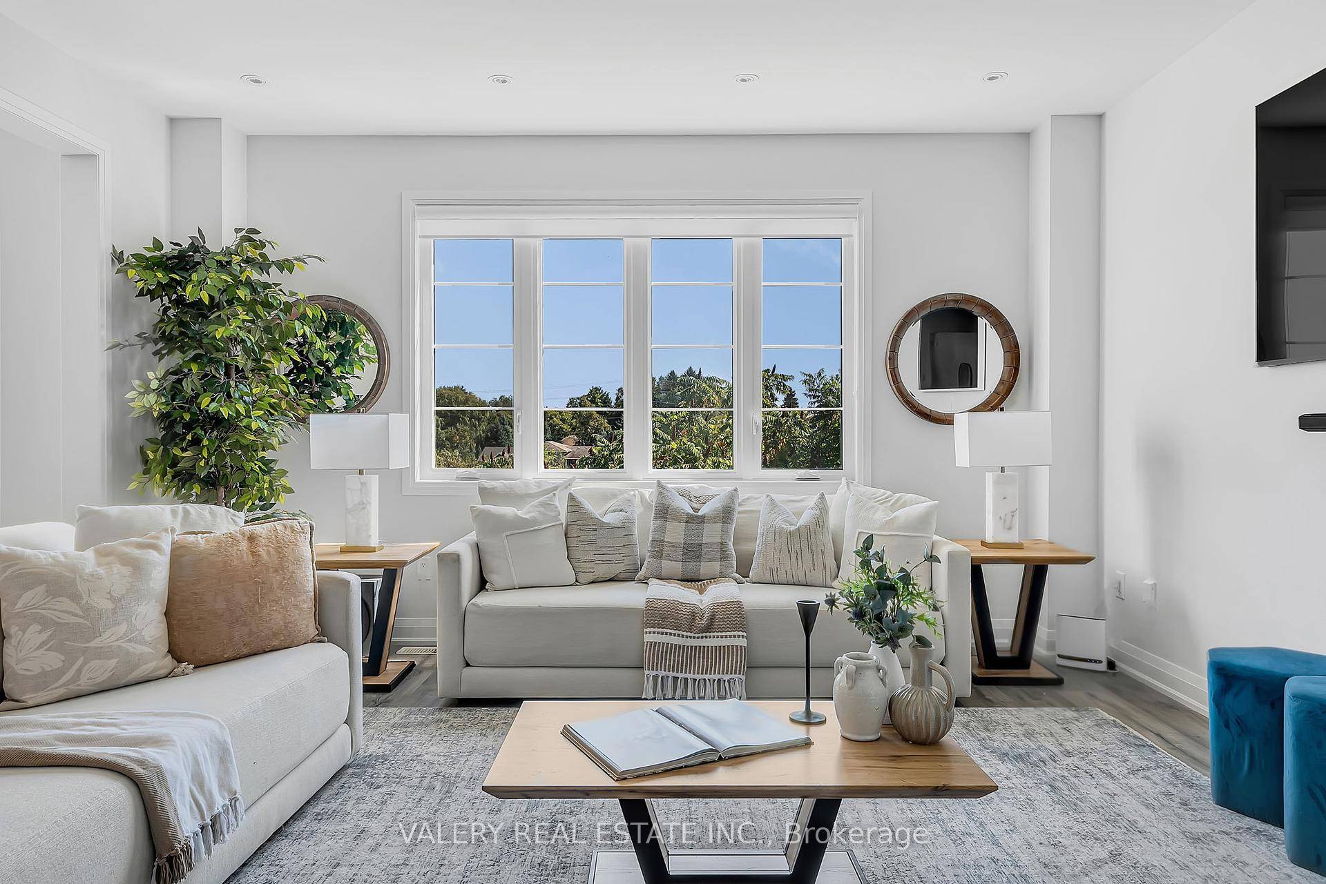 Discover understated luxury and modern form in this masterfully crafted residence, gracefully positioned on a coveted ravine lot within Fergus prestigious Summerfields Community.