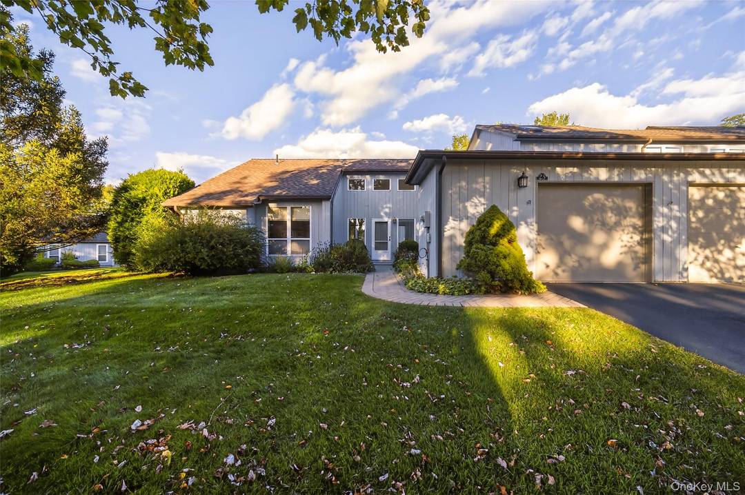 Welcome to The Woods ! Built in 1986, this end unit condominium offers the ease of one floor living with 2 bedrooms, 2 full baths, and a 1 car garage.