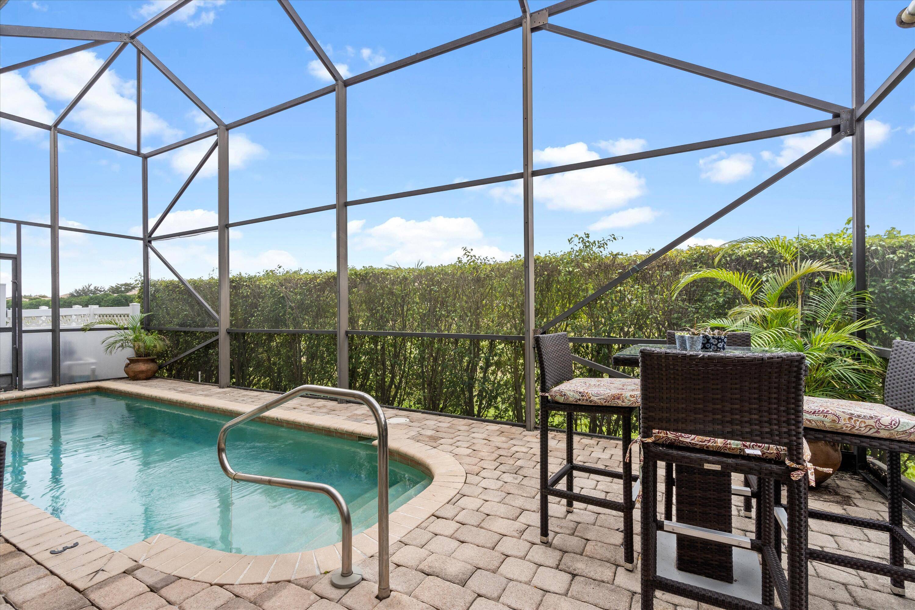 This one story courtyard townhome has 3 bedrooms, 3 bathrooms, a 2 car garage and a lovely screened in back patio with pool !