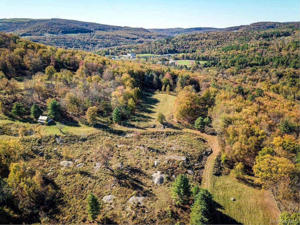 This remarkable parcel offers sweeping million dollar views, rolling fields accented by elegant stone walls throughout.