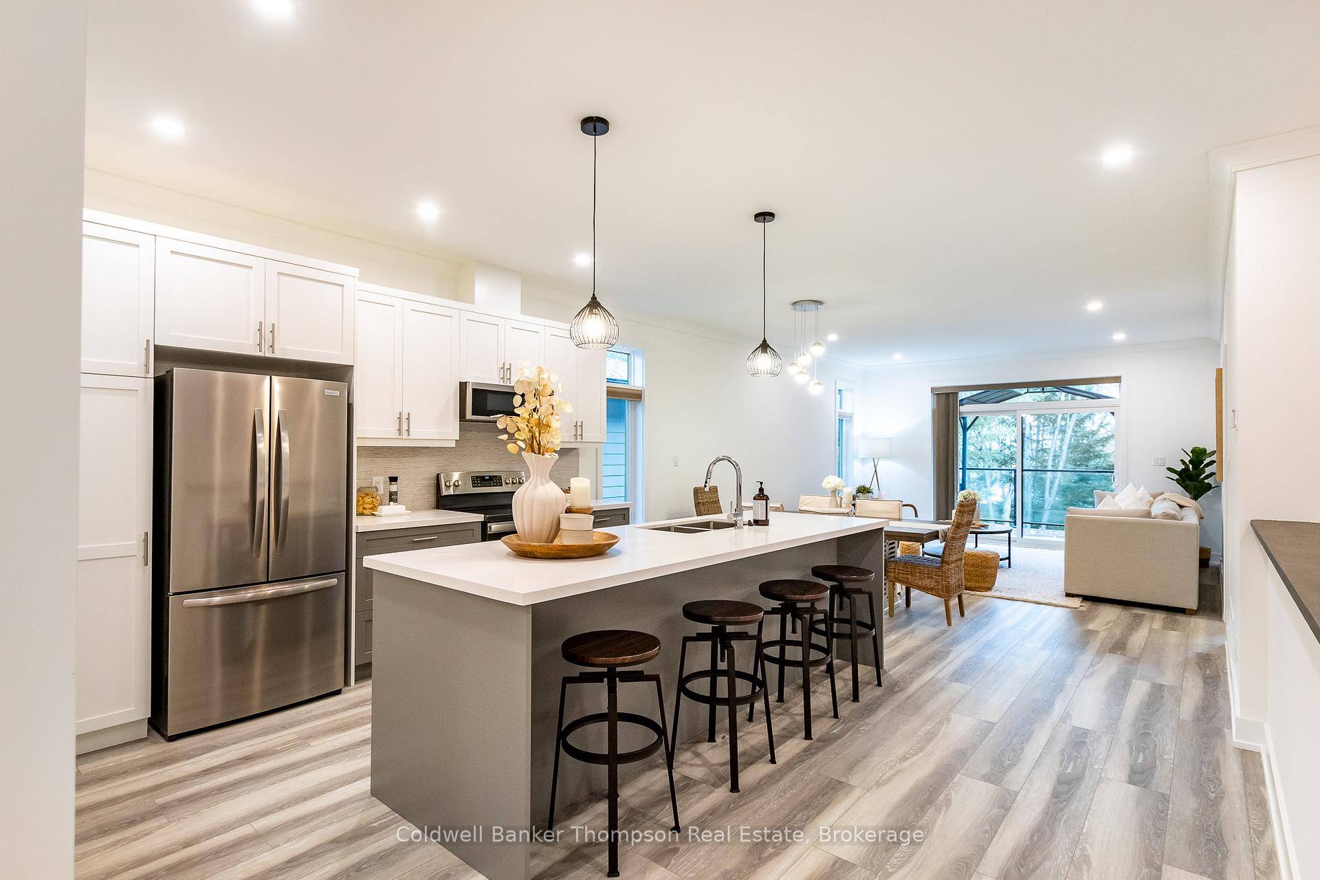 Welcome to this beautifully designed end unit bungalow townhouse in the sought after Highcrest community, built by Edgewood Homes in 2022.