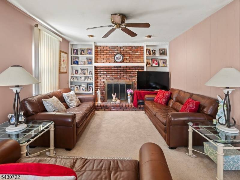 NYC commuter friendly home with updates, parking, and outdoor space in Hawthorne's desirable Goffle Hill section !