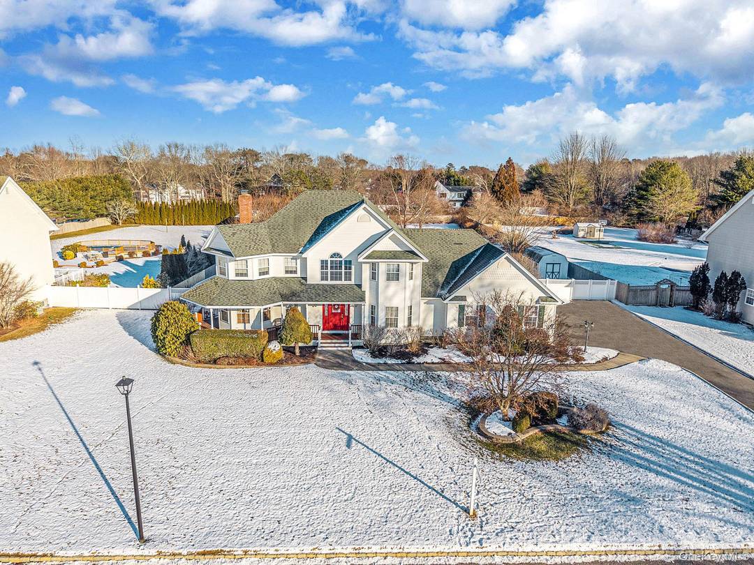 New to the Market and in the Heart of Manorville This Beautifully Maintained 5 Bedroom, 3 Bathroom Colonial is Located in the Prestigious Old Neck Estates.