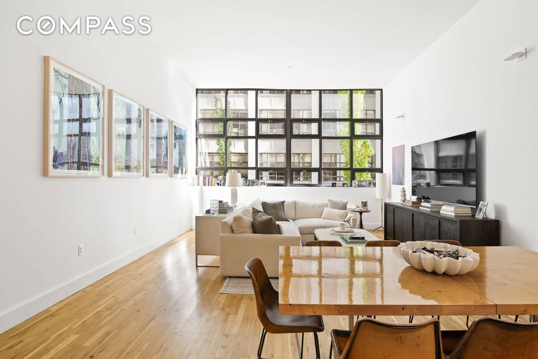 Perfect for entertaining, this stunning 2 Bed 2 Bath residence offers a seamless flow with its expansive open concept living and dining area, enhanced by soaring 13 foot ceilings and ...