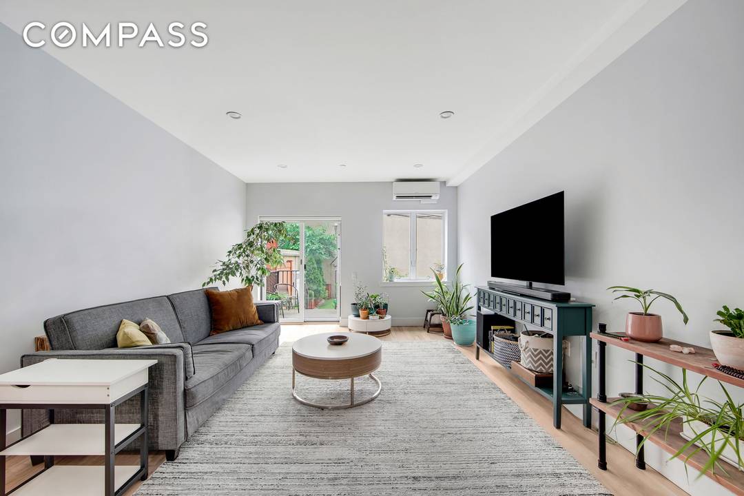 This rare 1, 094 SF duplex condo lives like a two bedroom, with 1.