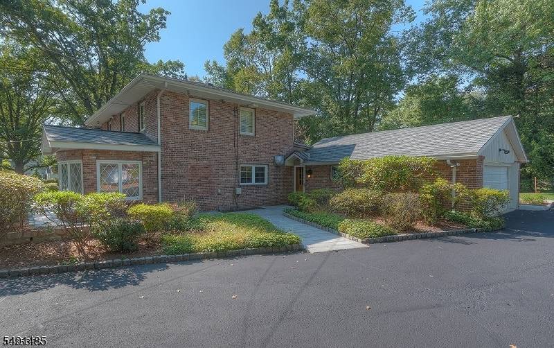 LOVELY CUSTOM BUILT ESSEX FELLS HOME FEATURES ALL LARGE ROOMS THAT CAN BE USED INTERCHANGEABLY TO MEET YOUR NEEDS !