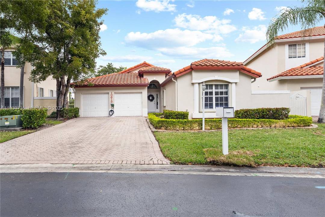 Welcome to this beautifully located 4 bed, 2 bath residence in the prestigious Doral Sands community located inside Doral Park.