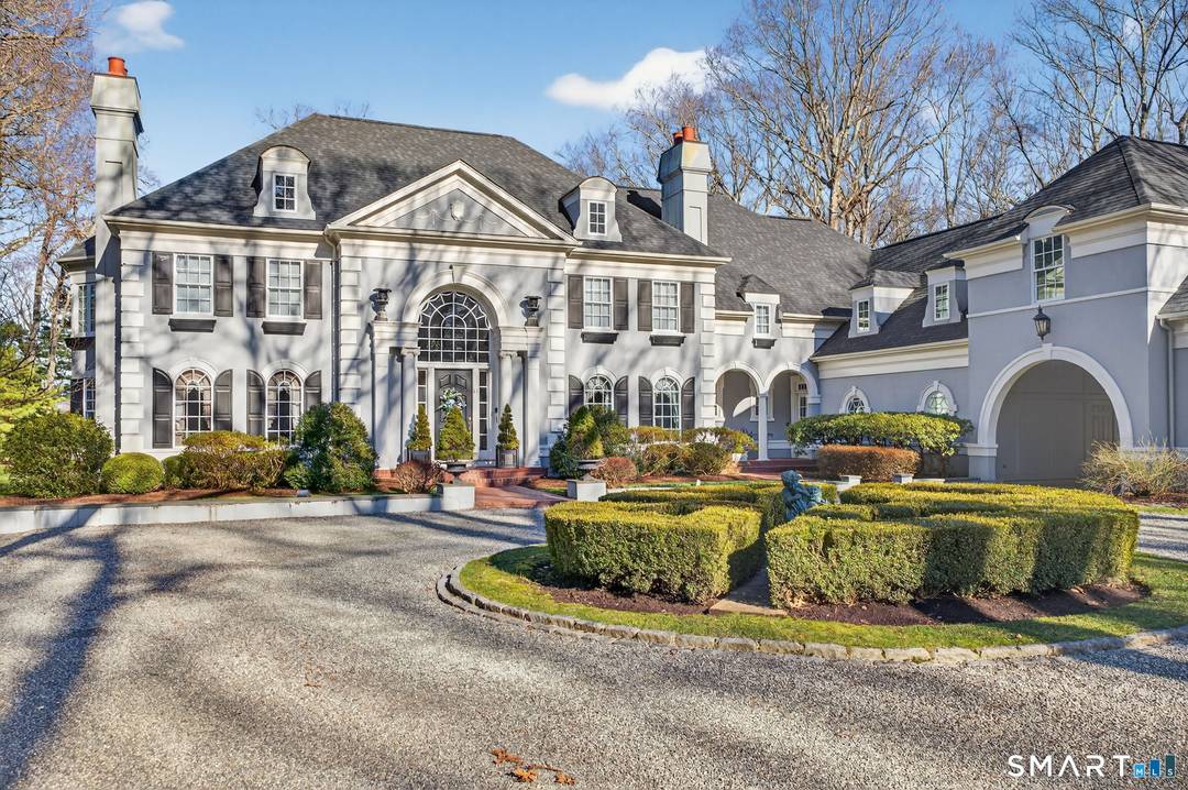 Riverside Elegance Meets Neoclassical Grandeur Experience the pinnacle of waterfront living in this breathtaking Grecian Colonial estate, perfectly situated on 3.