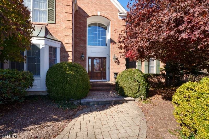 Boasting a prime cul de sac position, on over 5 park like acres, among similarly impressive homes, this handsome Traditional offers an abundance of space warmed by timeless detailing.