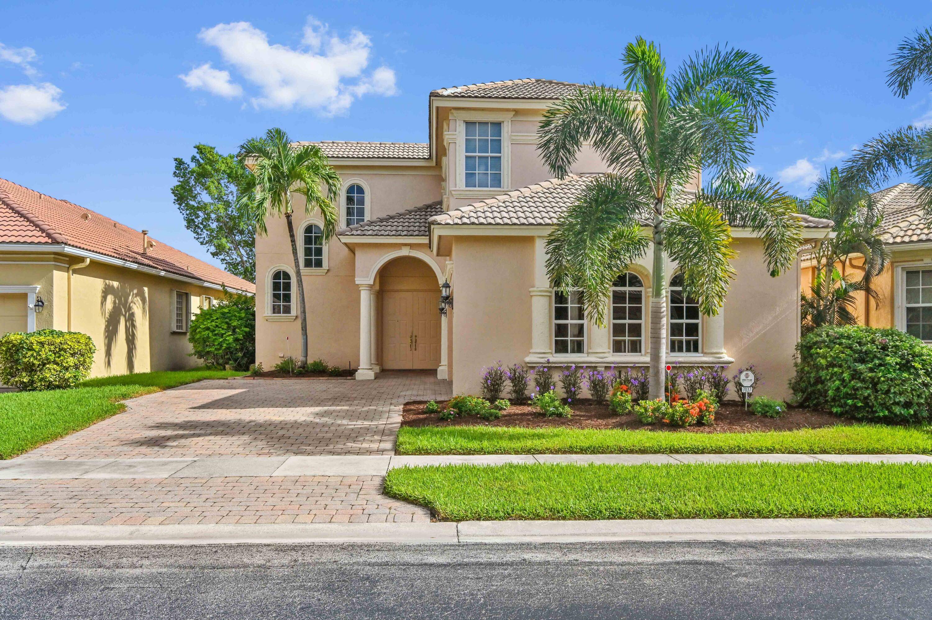 Captivating Waterfront Home in Mizner Falls an intimate gated community, Boynton Beach with Lake Views.