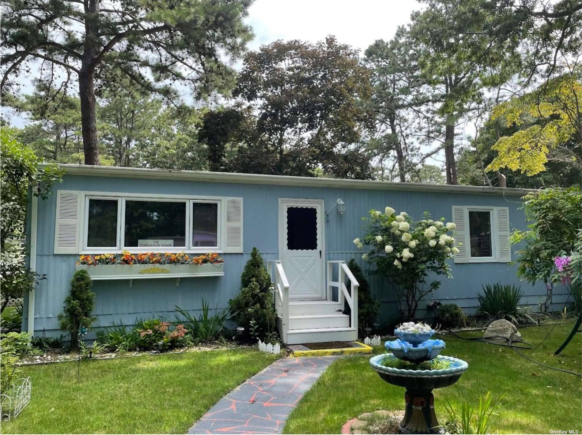 55 community. Beautifully landscaped home on a lovely corner lot.