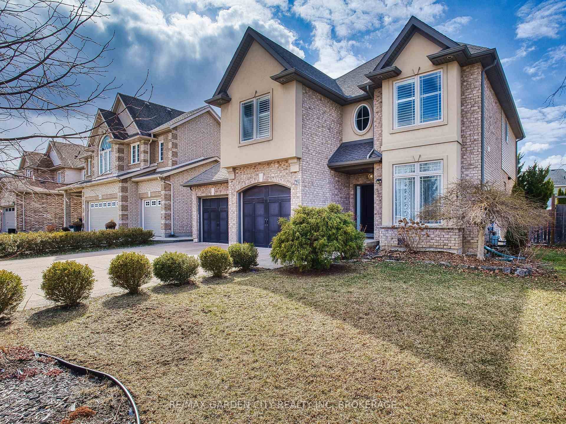 xquisitely crafted custom built executive home nestled on a quiet court.