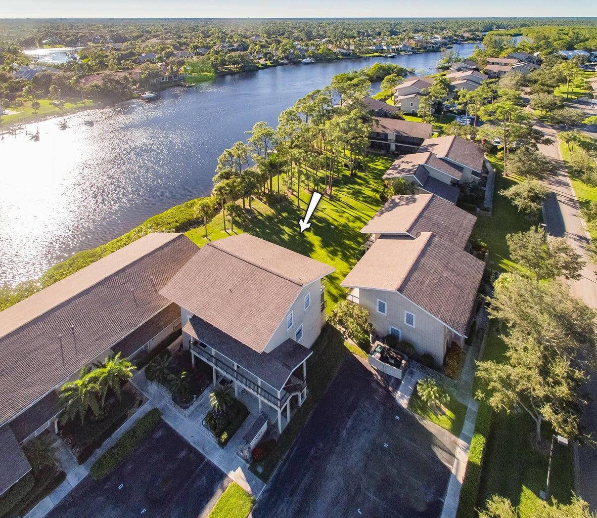 ON THE RIVER ! Hurry to see this fully renovated townhome with large balconies overlooking the sparkling Loxahatchee River.