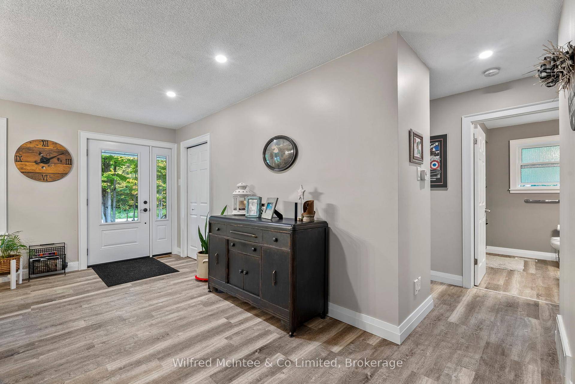 Completely renovated home and heated shop set on 25 private acres of hardwood bush, just outside Wiarton.