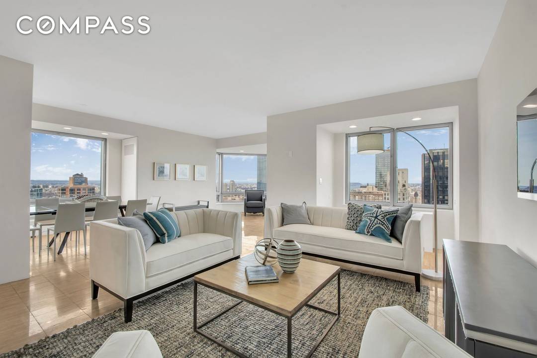 Stunning Central Park and Hudson River views define this prestigious two bedroom, two and a half bathroom corner residence perched above Central Park on the 48th floor.
