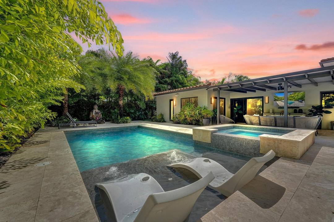 Experience a tue sense of zen in this Coral Ridge home which offers over 3, 000 sq ft of living space designed for effortless South Florida living.