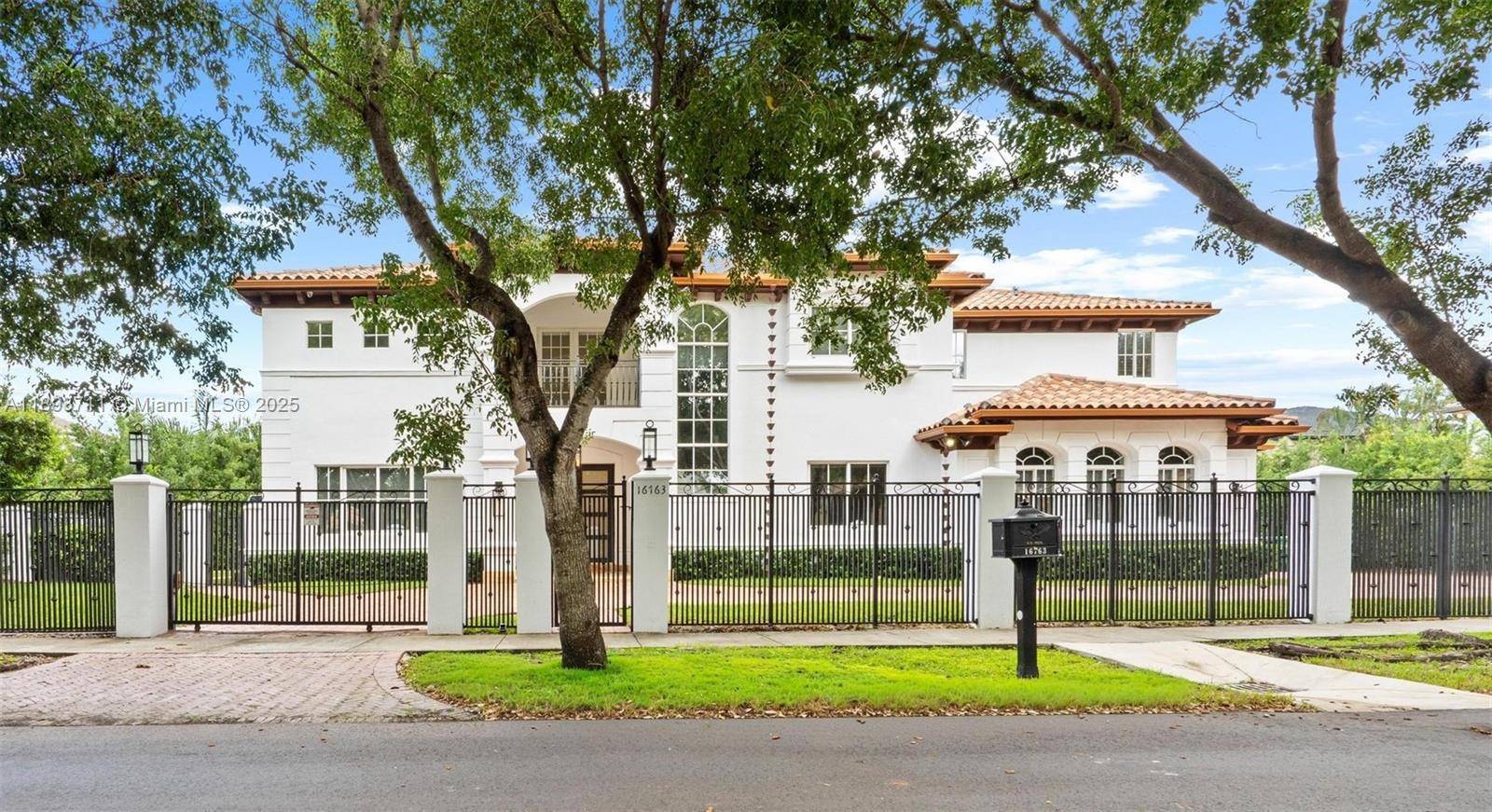 Exquisite 5 bed, 6. 5 bath estate located in the exclusive guard gated community of Royal Oaks.