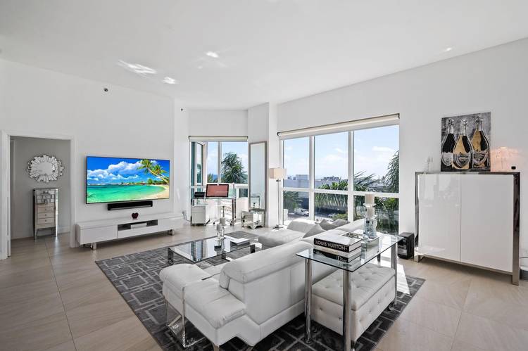 Exceptional southwest corner residence at the iconic Beach Club offering panoramic ocean, Intracoastal, and city views from sunrise to sunset.