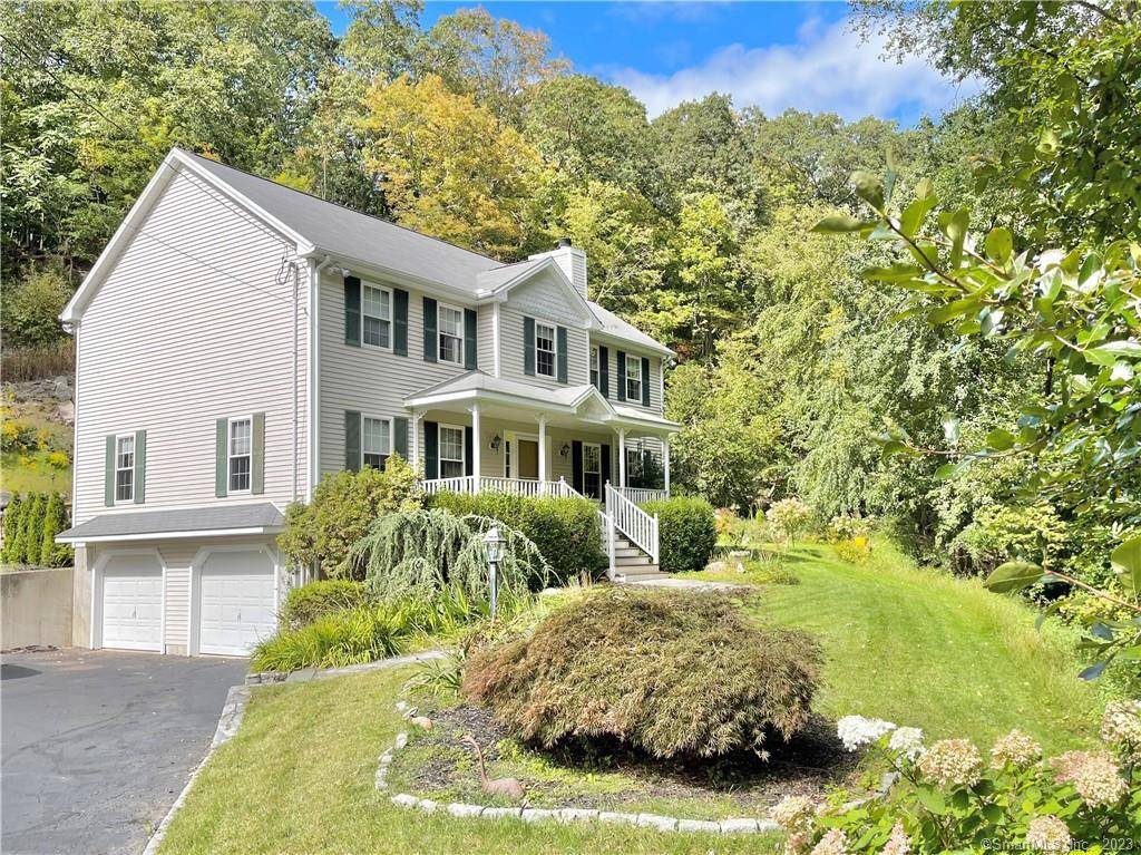 Exceptional newer colonial with welcoming covered front porch offering 4 bedrooms and 2.