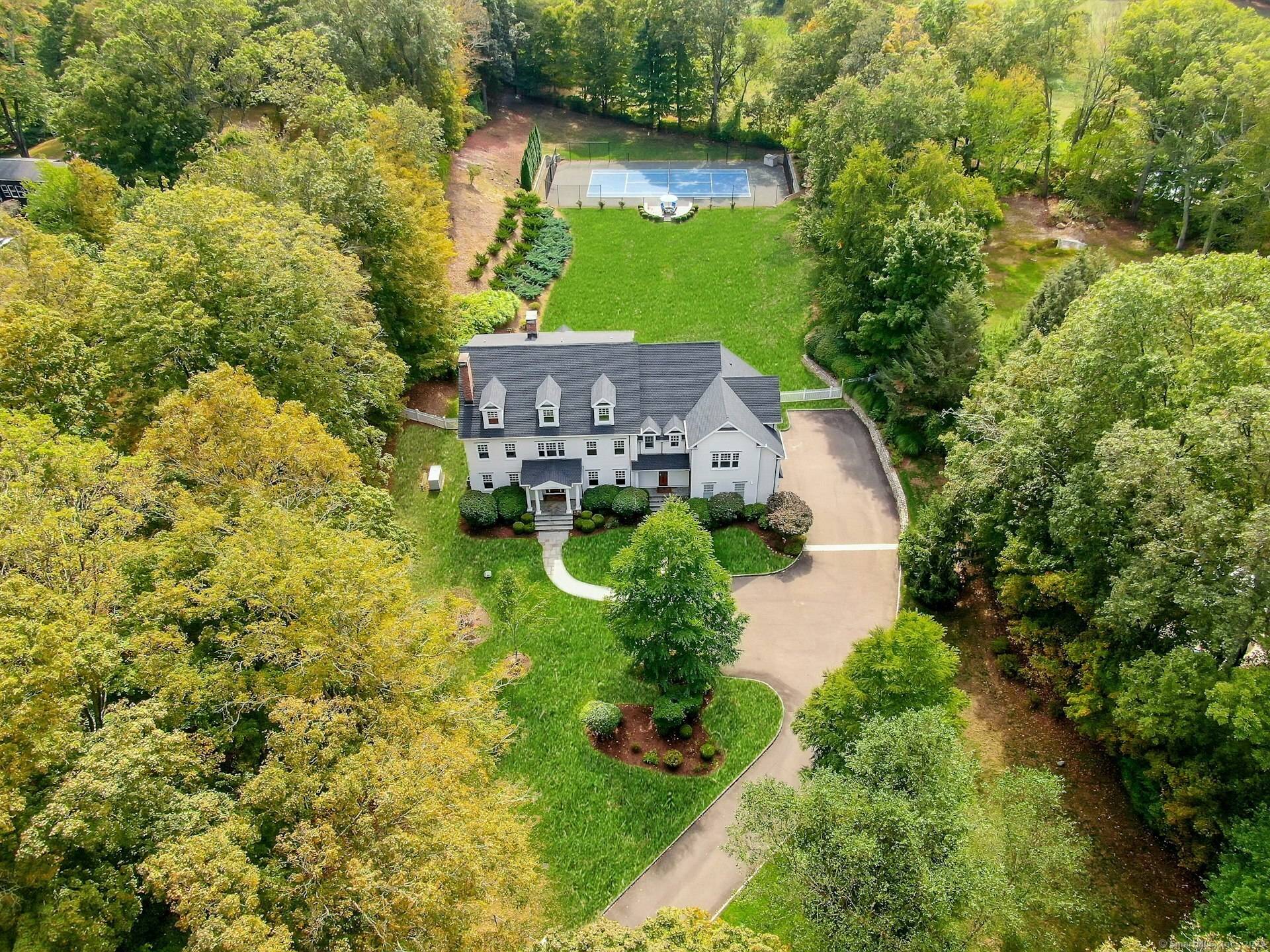 Crafted by noted custom builder Garrett Wilson and meticulously enhanced with recent upgrades, this Greenfield Hill home is as impressive as it is inviting.