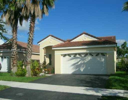 Beautiful one story home located in the highly desirable gated community of San Remo in Weston.