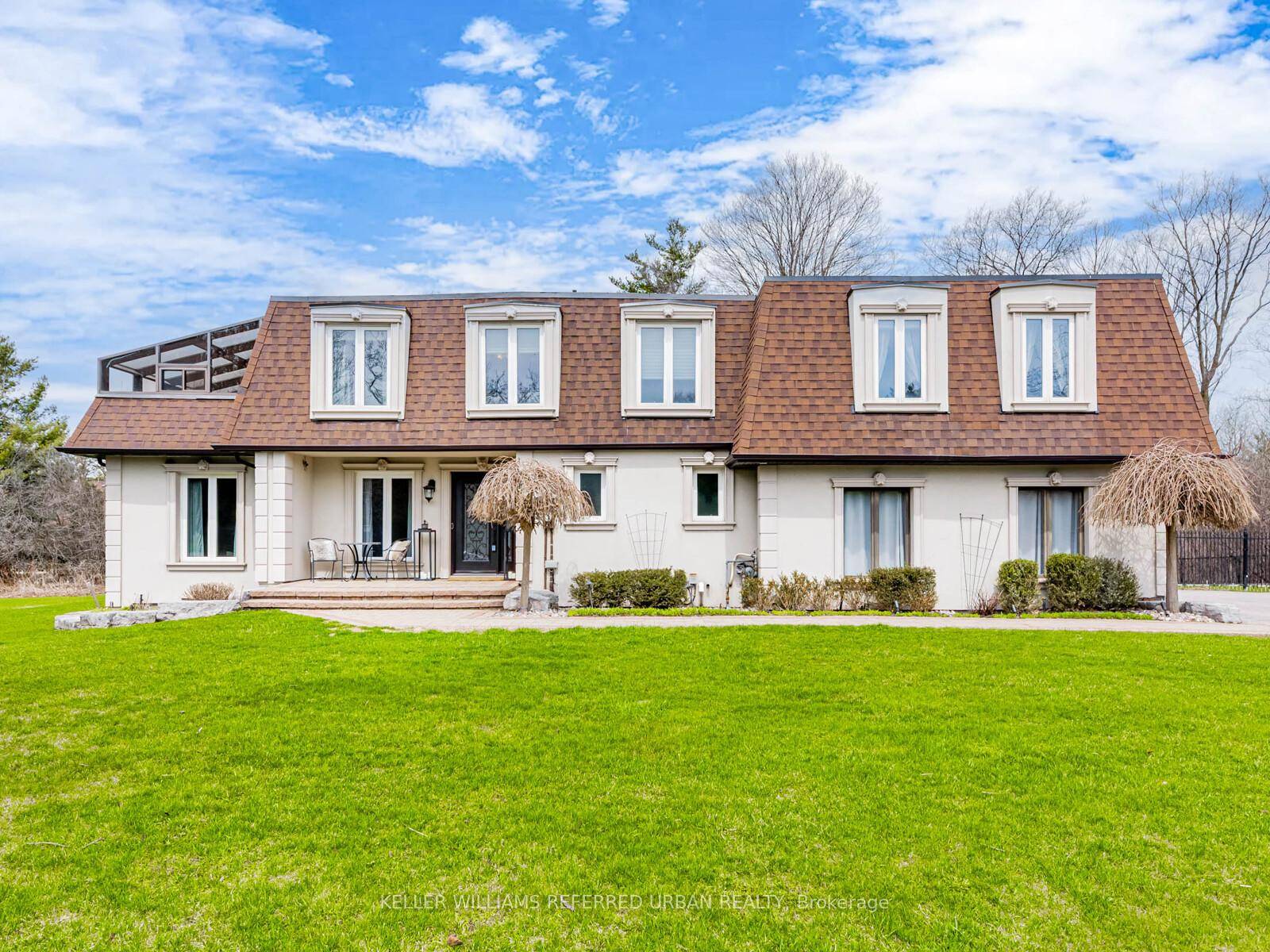 Welcome to Aurora Estates, where this stunning 2 storey detached home sits on nearly 2 acres of serene land backing onto a ravine.