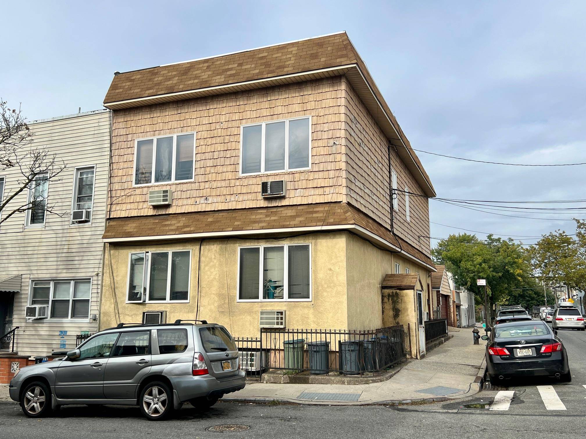Legal 3 family semi detached corner property with finished basement and separate 2 car garage.
