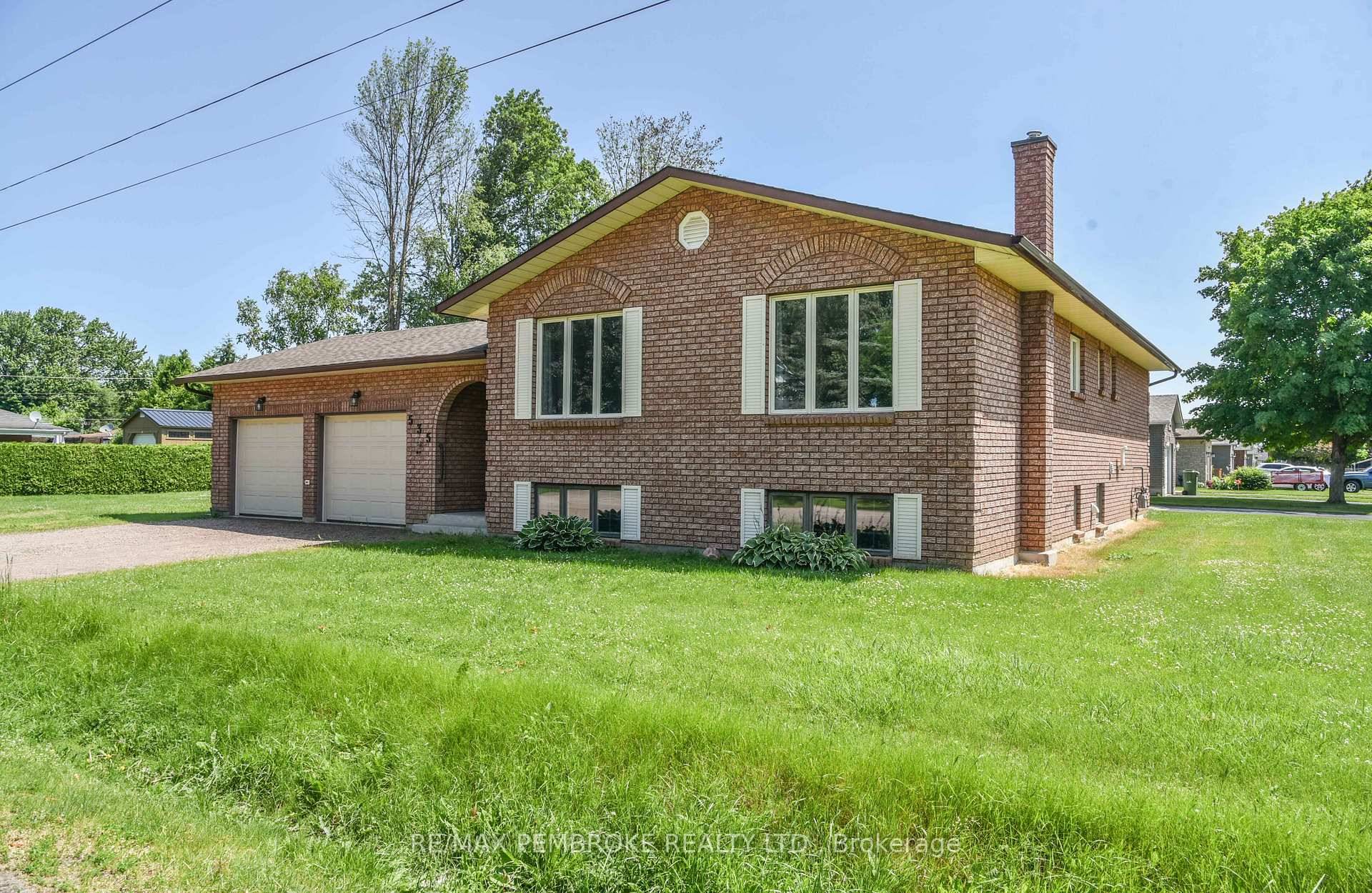 Welcome to this beautifully maintained hi ranch home featuring an oversized kitchen with solid wood cabinetry, perfect for family gatherings and entertaining.
