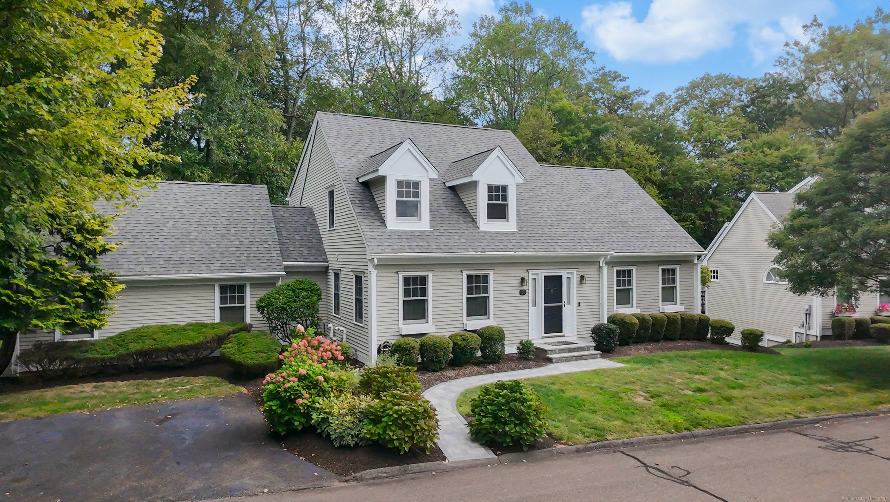 Welcome to Four Winds a community where comfort and style come together in a delightful Nantucket inspired cap col.