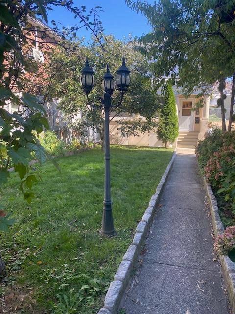 Two Family home in good location offers 5 rooms plus enclosed porch on first level and 4 rooms with balcony on second level along with large front yard with peach ...