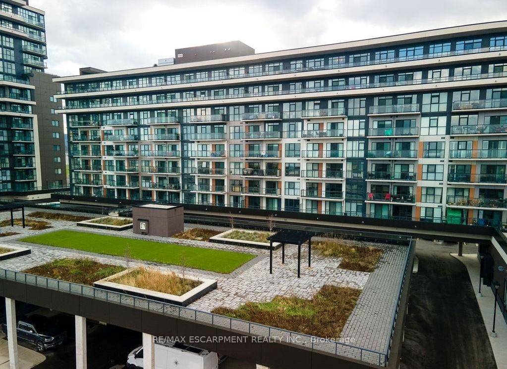 Lake views for days. Unit 810 at 560 North Service Rd puts you above it all in Grimsby on the Lake.