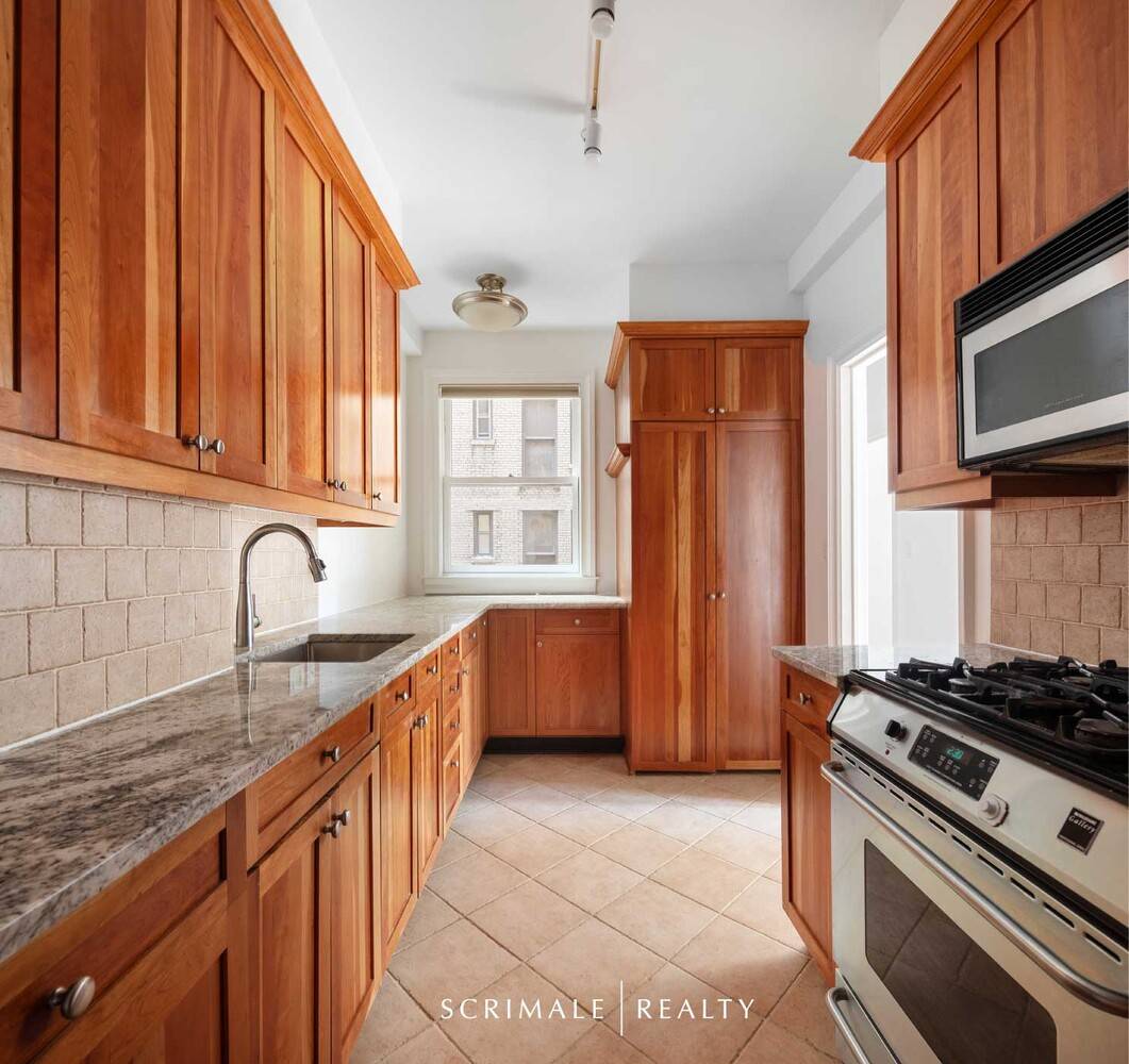 Bright and spacious, this south facing two bedroom, two bathroom apartment features a beautiful living room with high beamed ceilings and crown moldings, a large renovated kitchen, a vented washer ...