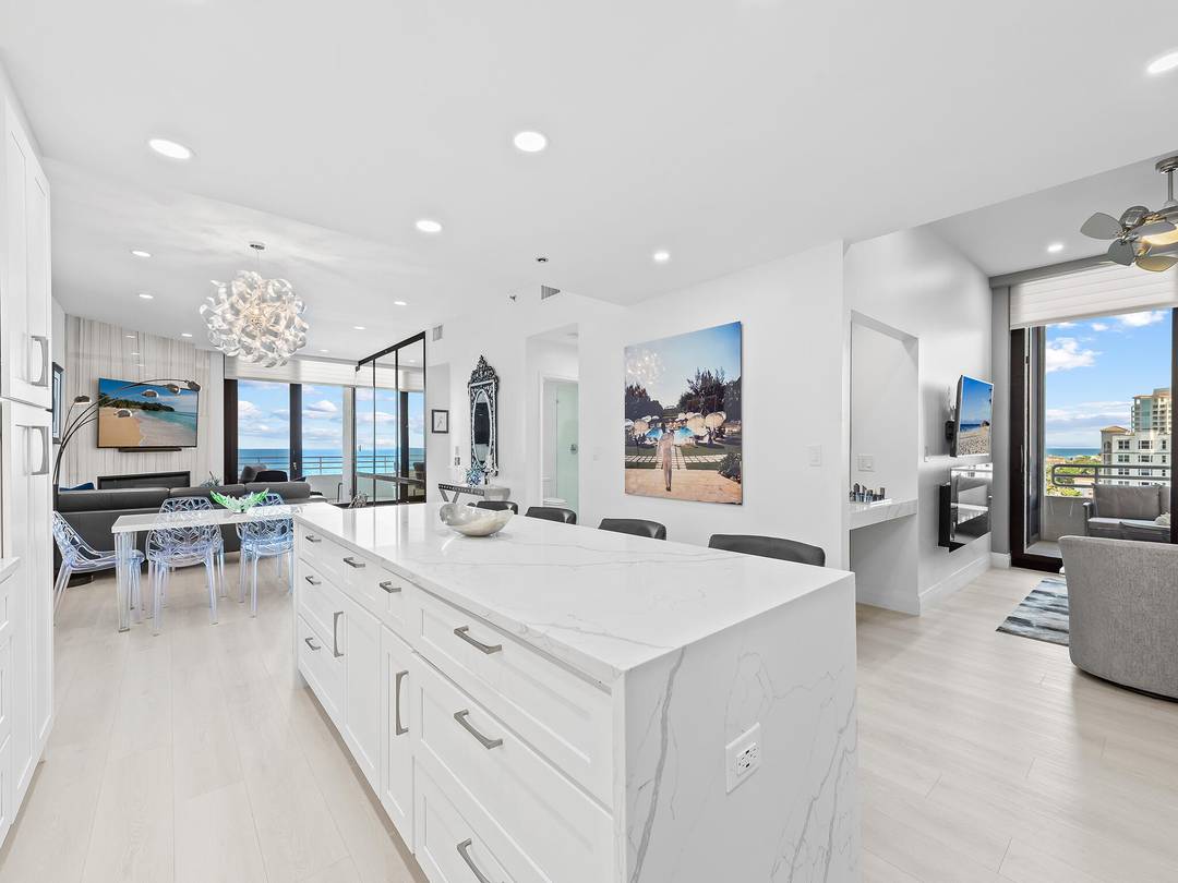 Unobstructed Ocean Views from this totally redesigned turnkey Lower Penthouse residence !