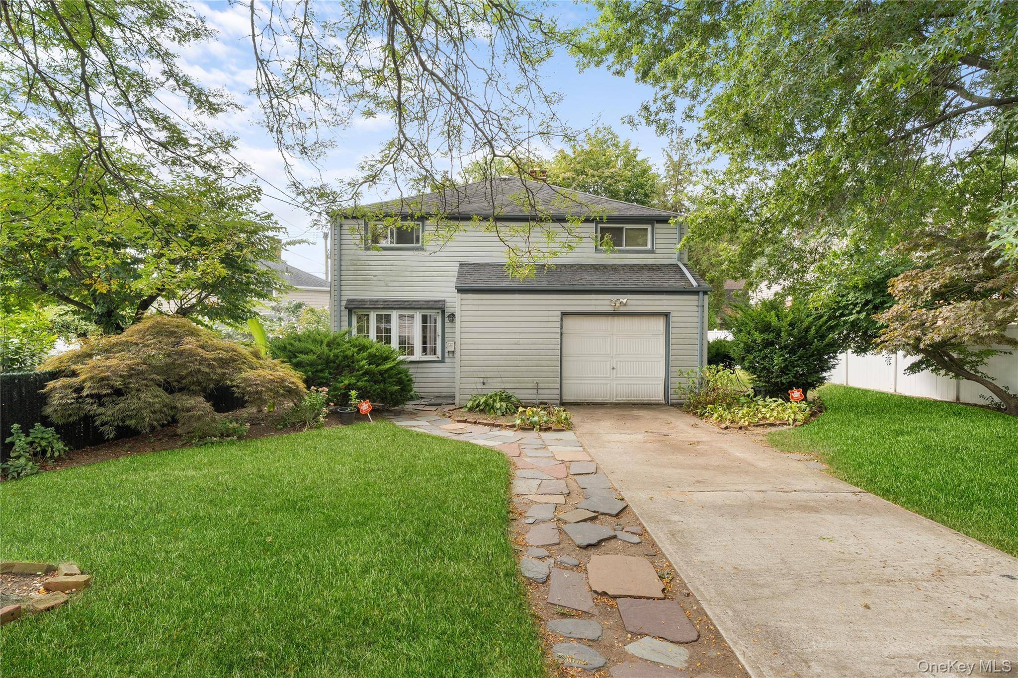 Welcome to this charming and spacious 4 bedroom Colonial style home !