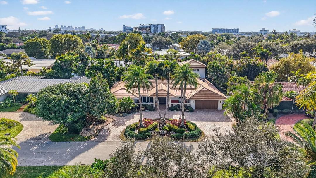 Meticulous one of a kind resort style estate on an oversized lot in Coral Ridge Country Club.