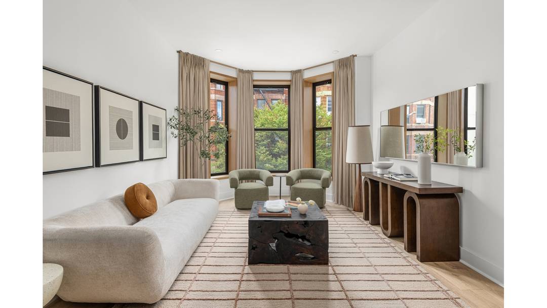 The Penthouse at 22 Saint Johns Place is a rare offering a full floor, penthouse three bedroom, two bathroom home with a private roof deck and sweeping skyline views.