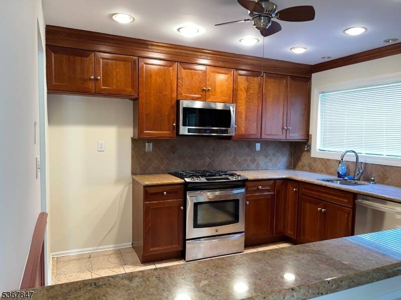 Desirable End Unit, Ranch style TH with 2 bedrooms and a one car garage.
