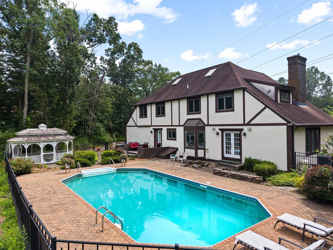 Welcome to 22 Hickory Hill Ln in Branford a stunning Modern Tudor style home designed with family comfort and entertaining in mind.