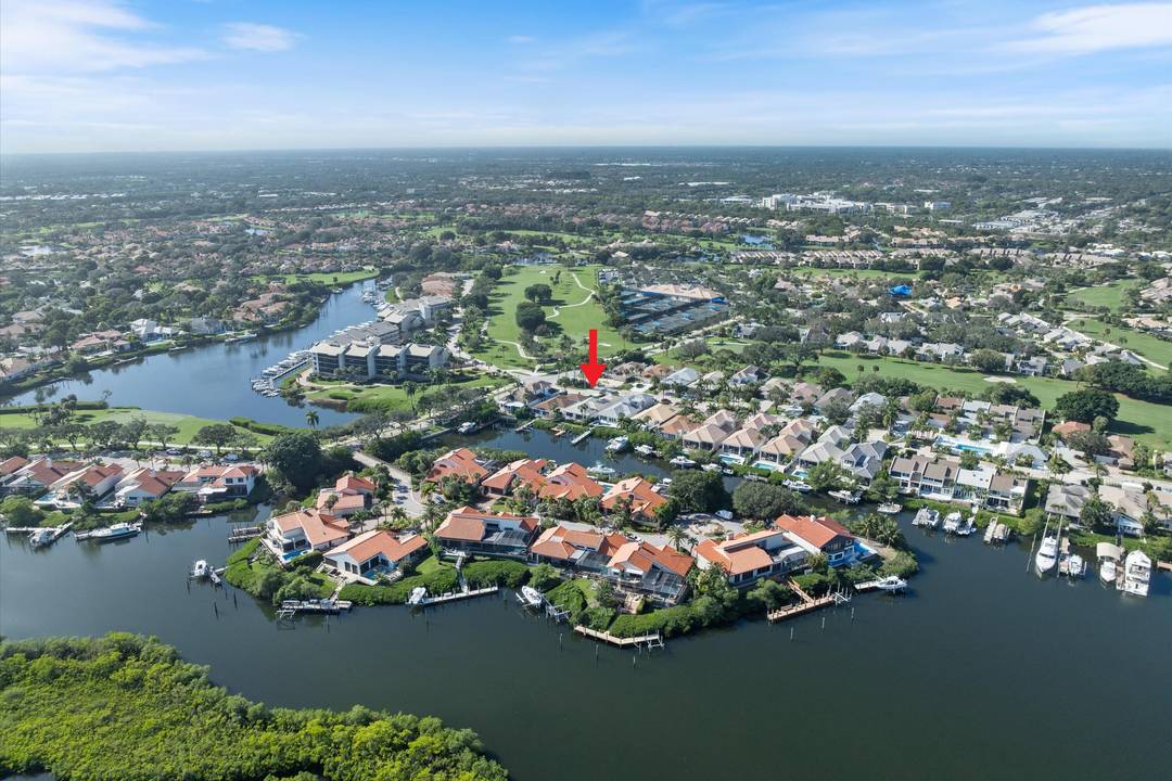 Waterfront dream home reimagined located in the prestigious gated community of Jonathan's Landing, right in the heart of Jupiter.