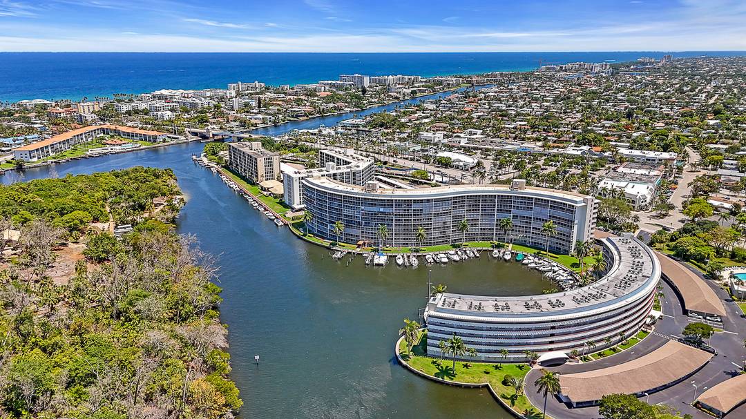 The finest three bedroom waterfront residence in Hillsboro Cove, offering unparalleled views of the river Capone Island.