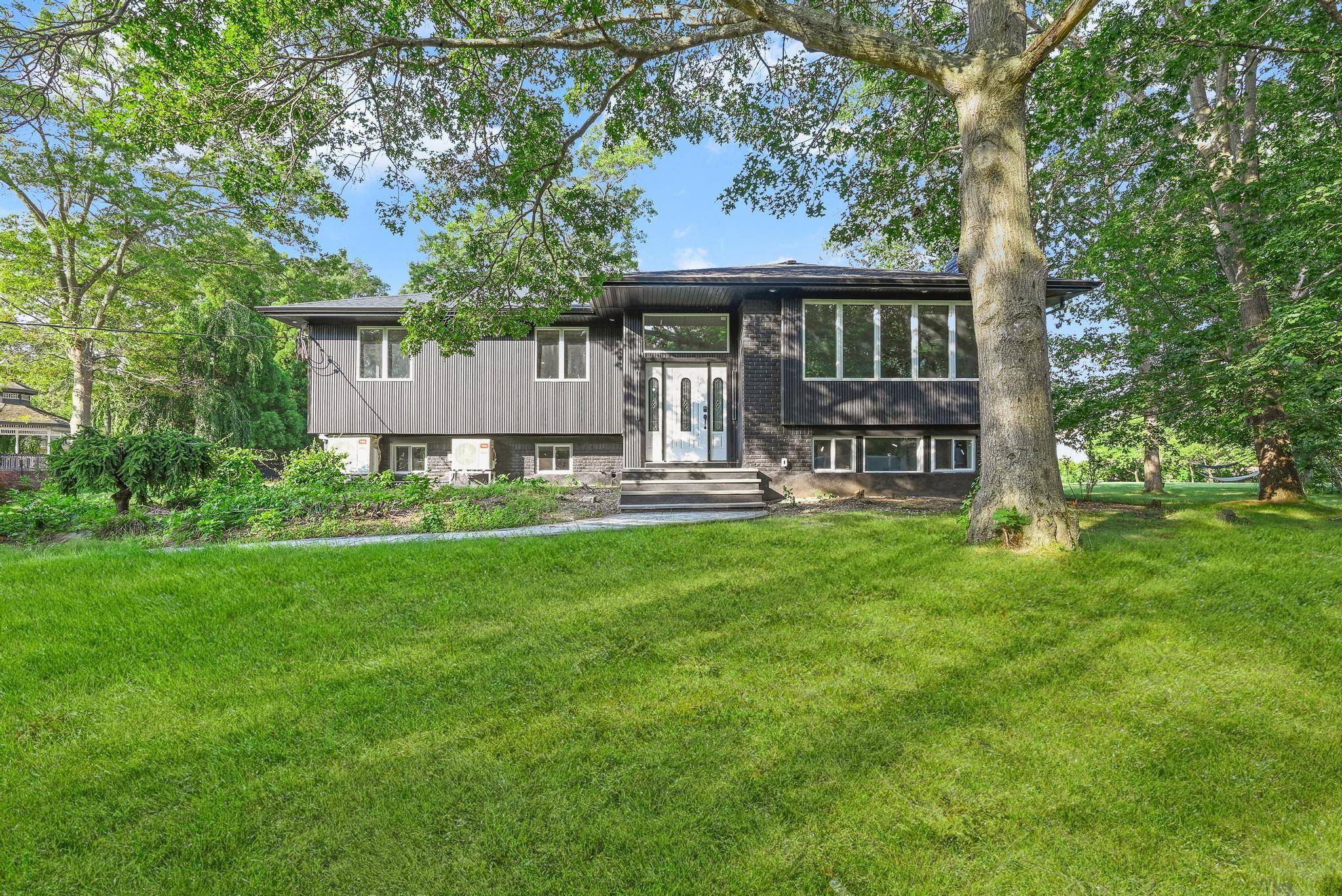 Welcome to 4 Wintergreen Dr, Melville a meticulously fully renovated luxury home located in one of Long Island s most sought after neighborhoods.