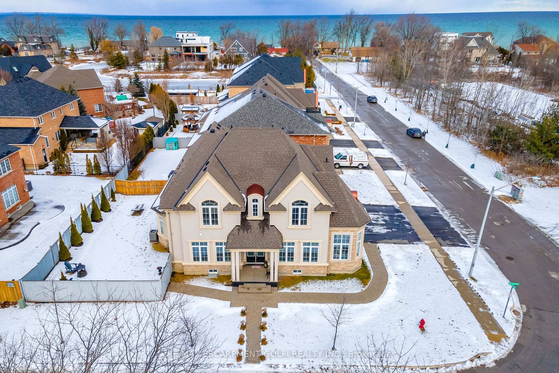 Welcome to 3 Shippee Avenue, a striking contemporary home situated on a premium corner lot just steps from the picturesque Fifty Point Marina.