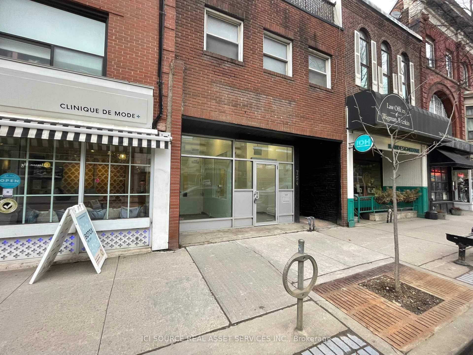 2732 sq ft of upgraded, modern storefront retail space with 11 to 16 foot ceilings suitable for various types of business.
