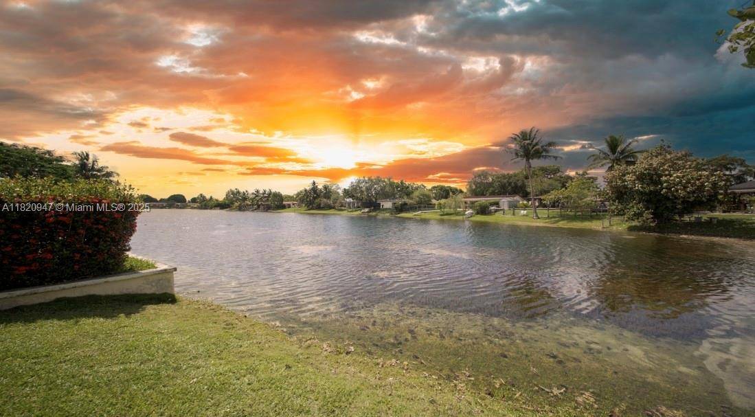 Lakefront open concept home with 3 bedrooms, 2 bathrooms, and a 4th additional room den with lake views.
