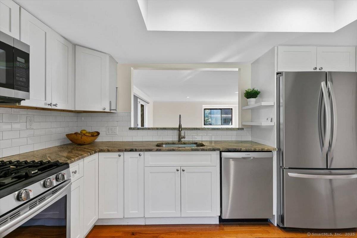 WOW ! This AMAZING remodeled 2 bedroom ranch condo is perfect for anyone looking for easy living complete with a chair lift for added convenience.