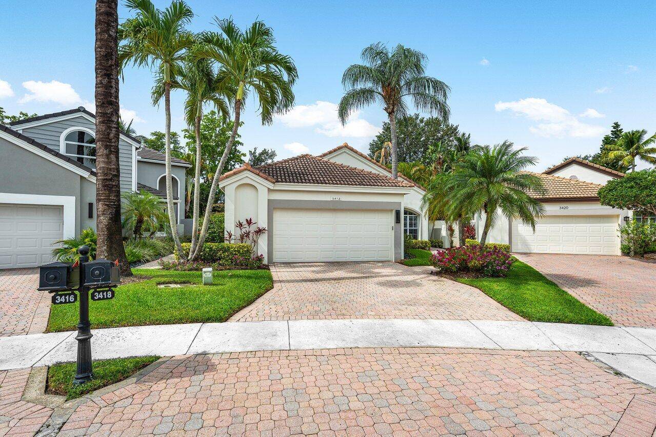 Welcome to 3418 NW 51st Place an impeccably renovated residence nestled in the Stratford Green subdivision of the sought after Woodfield Country Club.