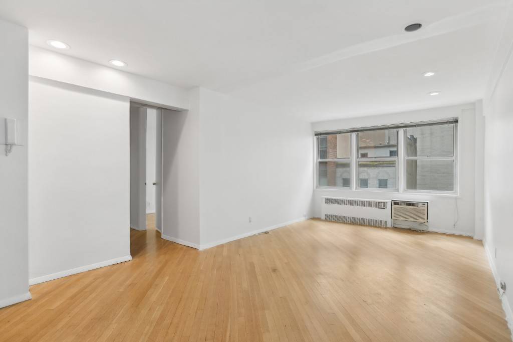 Welcome to The 141 Condominium, a spacious and sunny south facing condo in Midtown East.