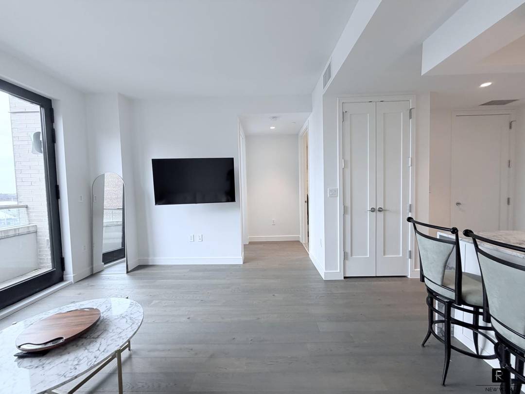 Welcome to Residence 9E at BLVD Condominiums An elegant, airy condo in the heart of Forest Hills.