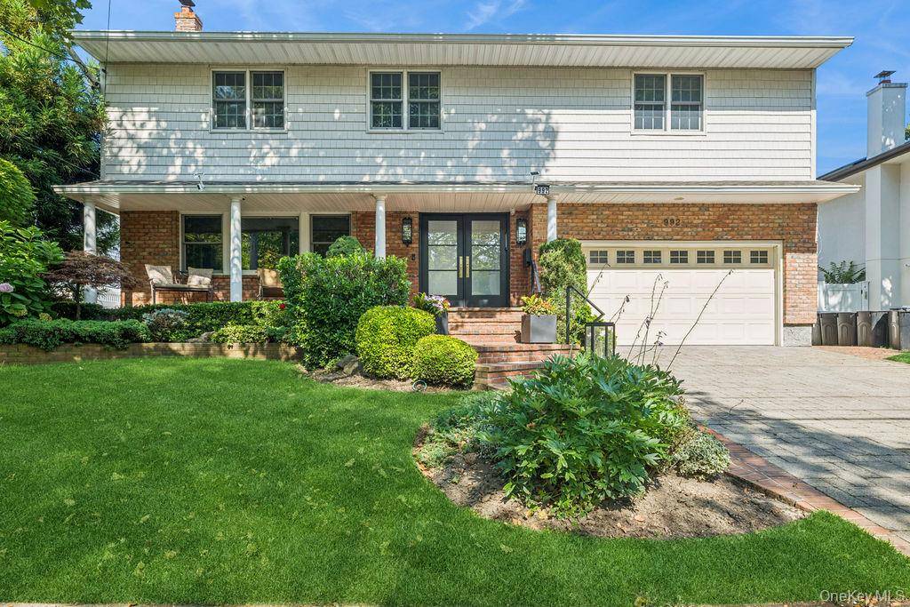 Welcome to this stunning, fully renovated Colonial offering the perfect blend of timeless elegance and modern luxury.