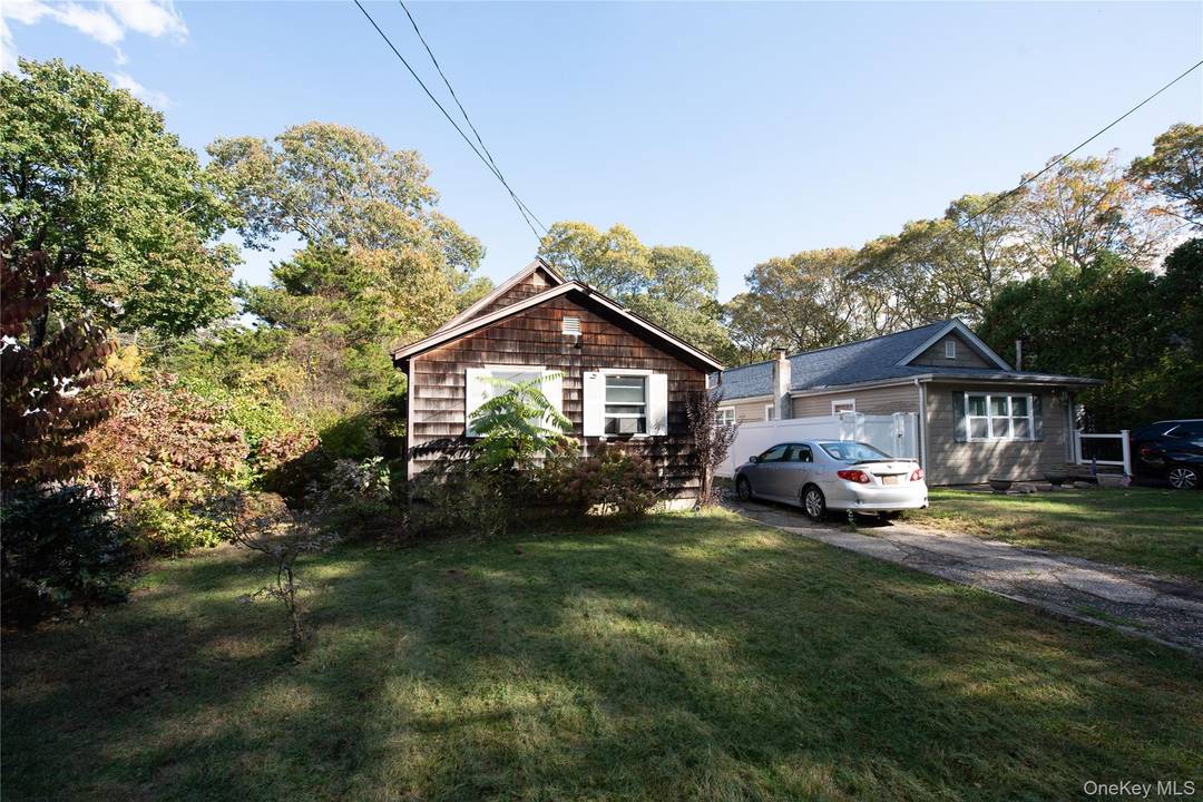 Cape cod home featuring 3 bedrooms with updated kitchen, bathroom and spacious primary bedroom.
